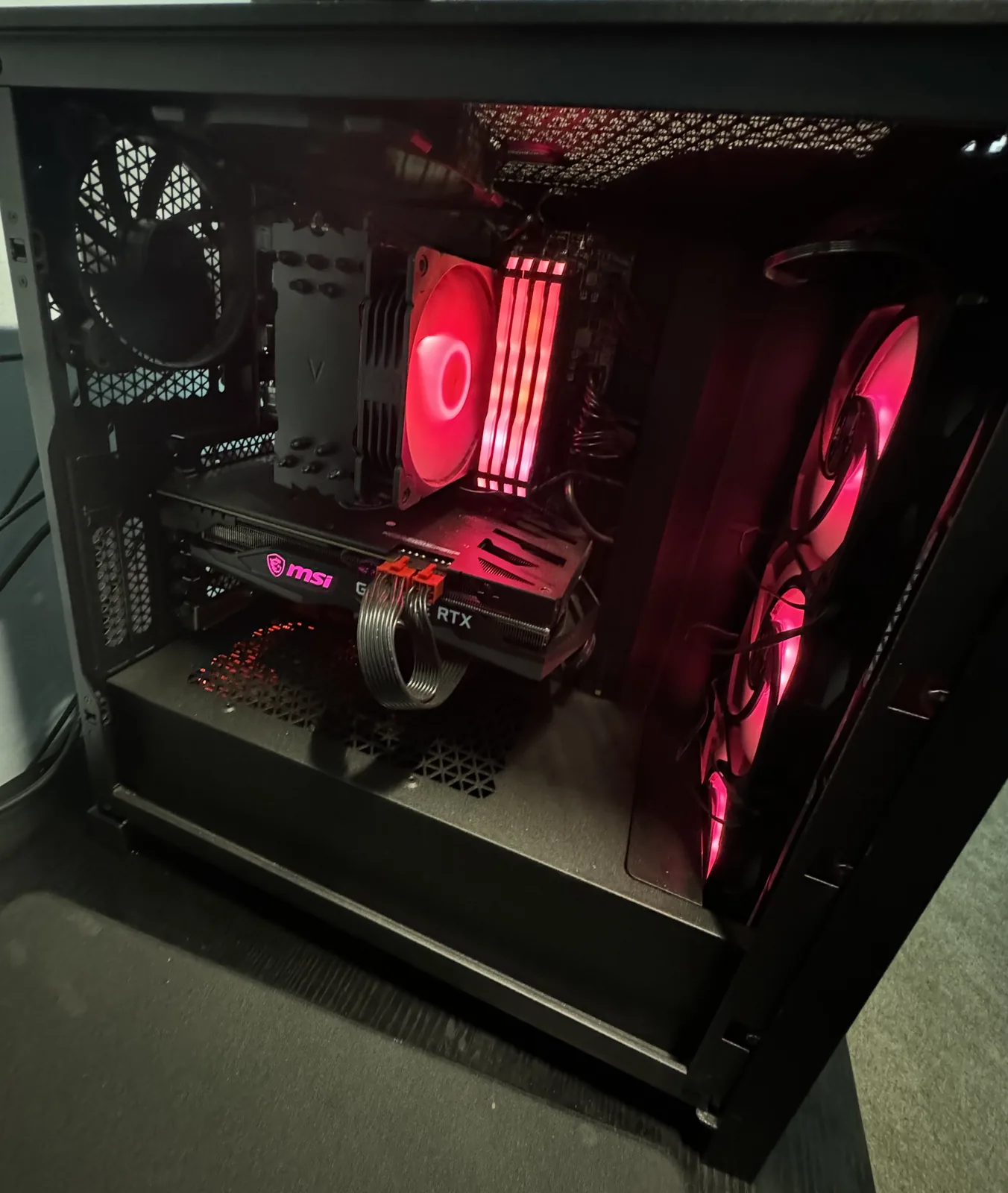 Harish's personal Ryzen 7 and RTX 3060 desktop with red internal lighting